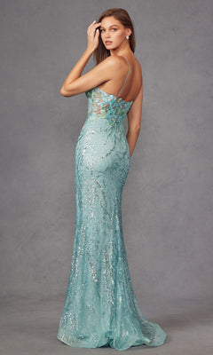 A woman in the Juliet Long Prom Dress JT2425A—fitted, floor-length, pastel with light blue sequins and thin straps—stands facing away, glancing over her shoulder.
