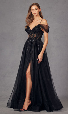 A woman models the Sheer-Waist Long Prom Ball Gown Juliet JT2466A—an elegant black, off-the-shoulder dress with a sheer bodice, floral accents, high slit, and spaghetti straps—against a plain gray background.