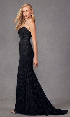 Model wearing the Strapless Long Sequin Prom Dress Juliet JT2472R, featuring a sweetheart neckline and subtle shimmering sequins, standing against a plain gray background.