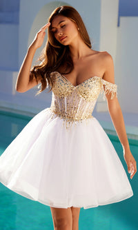 A woman stands by a pool in the Juliet JT947L, a short champagne corset prom dress featuring a white/gold fitted sequin bodice, sheer detailing, and off-the-shoulder tulle.