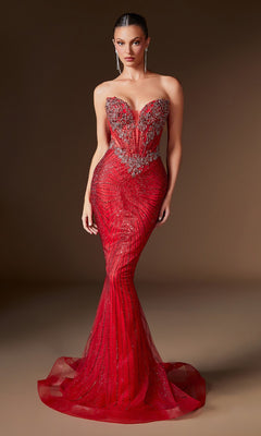 A woman wears the Ladivine KV1129 Strapless Long Mermaid Prom Gown—a bold red, beaded bodycon evening dress—showcasing intricate embellishments and a dramatic silhouette against a plain brown background.