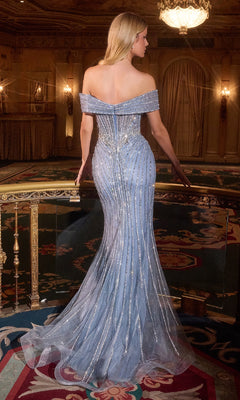 Woman in a light blue off-shoulder evening gown in an elegant room.