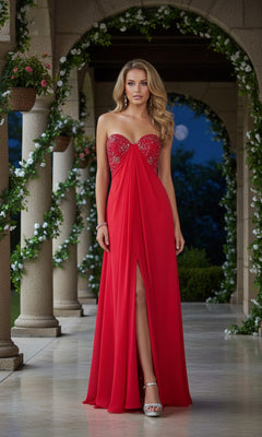 A woman stands on a veranda at night, wearing the La Femme 20023 strapless long prom dress in red, featuring a sweetheart neckline, thigh-high slit, and silver embellished bodice.