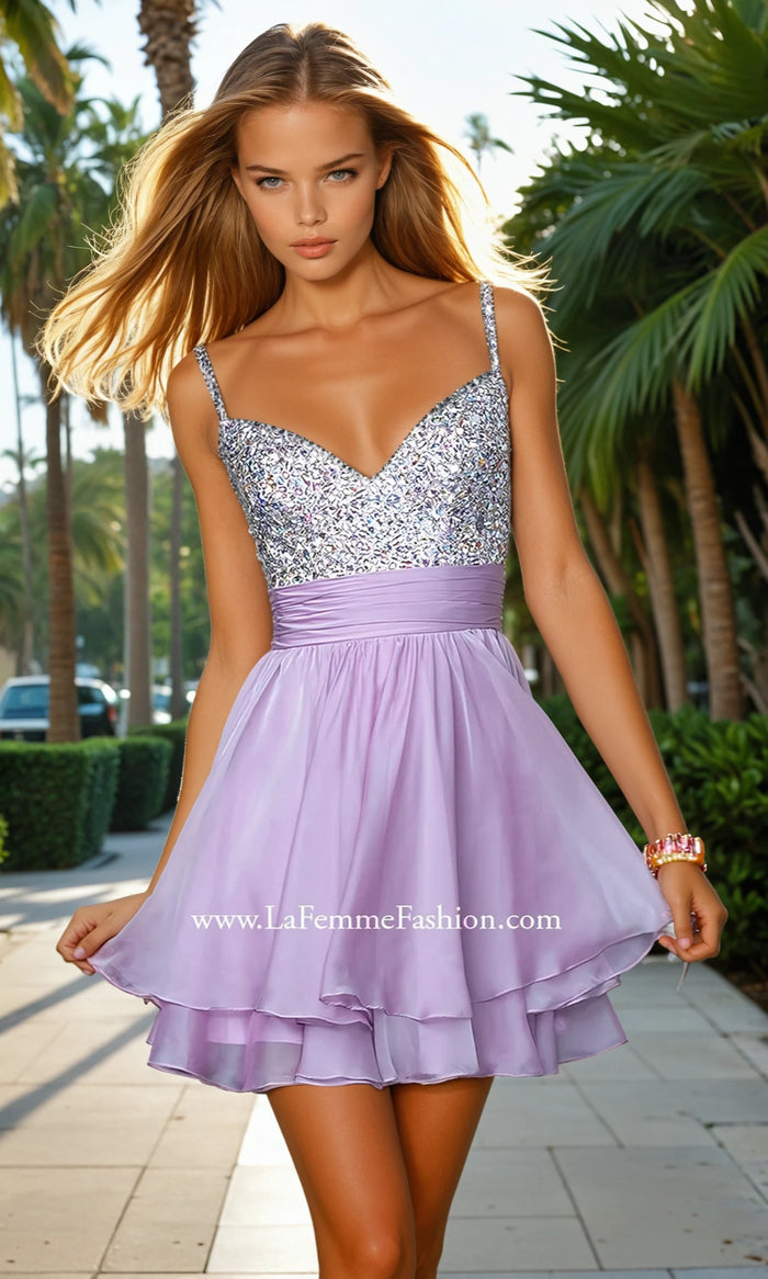 Woman wearing a sparkly silver top and lilac skirt with palm trees in the background