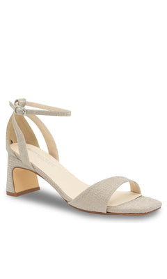 The Lilibet Champagne Prom Shoes: Touch Ups 4670 feature a single beige heeled sandal with an ankle strap, open toe, and low block heel, displayed on a white background—ideal elegant low-heel prom shoes.