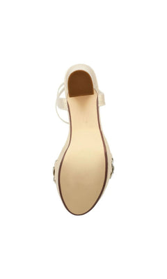 Bottom view of a shimmering champagne-colored Lily Champagne Platform Prom Shoes: Touch Ups 4709 block heel sandal accented with a jeweled flower.