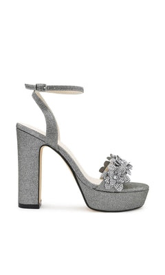 Lily Pewter Platform Prom Shoes: Touch Ups 4710 silver glitter platform high heel sandals with an ankle strap and a rhinestone flower embellishment on the toe.