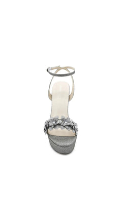 Lily Pewter Platform Prom Shoes: Touch Ups 4710 silver glitter platform sandals with an ankle strap and a rhinestone flower detail over the toe.