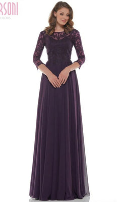 A woman stands against a white background wearing the Marsoni M238SL long formal dress in eggplant, featuring three-quarter sleeves, lace detailing, a beaded bodice, and a flowing chiffon A-line skirt.