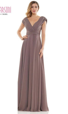 A woman wears the Marsoni M251, a floor-length mauve chiffon formal dress featuring cap sleeves, a deep V-neckline, and gathered waist detailing.