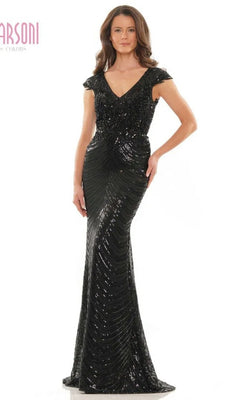 A woman stands against a plain white background, wearing the Marsoni M315 long formal dress—a black, floor-length evening gown with short sleeves, sequins, and a V-neckline.