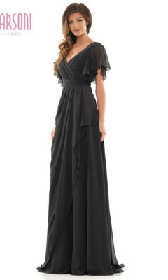 A woman models the Marsoni M320, a long formal black dress with flutter sleeves, V-neckline, and elegant A-line skirt, standing against a plain white background.