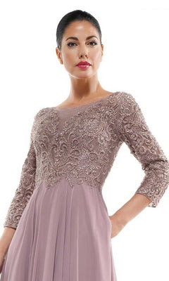 A woman models the Marsoni MV1052 long formal dress, featuring a beaded bodice, three-quarter sleeves, and a mauve chiffon A-line skirt, posing against a plain white background.