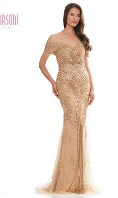 A woman wearing the Marsoni MV1275 long formal dress with an off-the-shoulder neckline and intricate beading poses against a white background.