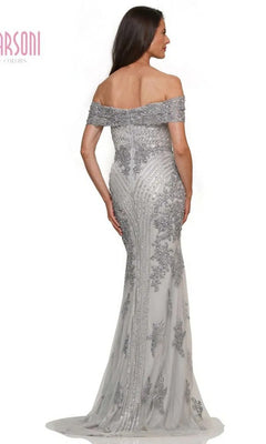 Woman in the Marsoni MV1275 long formal dress, featuring an off-the-shoulder neckline, silver-gray beading, and a fitted floor-length silhouette, elegantly photographed from the back.