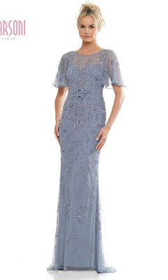 A woman wears the Marsoni MV1281 long formal dress in slate blue, featuring short sheer sleeves, an illusion sweetheart neckline, and intricate beadwork on the bodice and skirt.