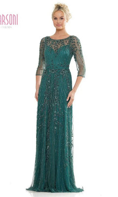 A woman wears the Marsoni MV1283 Long Formal Dress in deep green, featuring sheer sleeves and intricate beaded details—a sophisticated option for the mother of the bride or any formal event.