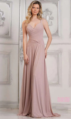 A woman wears the Marsoni MV1316, a pale pink, floor-length sleeveless formal dress with a ruched bodice, standing in an ornate room with white panel walls.