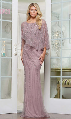 A woman stands indoors in front of glass doors wearing the Marsoni MV1343 long formal dress—a mauve, floor-length column gown with beaded embellishments and a sheer flowing overlay.