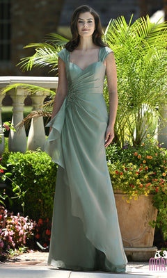 A woman wears a sage Marsoni MV1424 long formal dress featuring a chiffon sweetheart bodice, cap sleeves, and a decorative beaded waist accent.