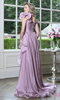 A woman standing in profile wearing a Long Formal Dress: Marsoni MV1425, a floor-length lavender ruffle evening gown with off-the-shoulder sleeves and a side-draped skirt.