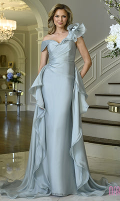 A woman wears a sage, floor-length Marsoni MV1425 evening gown featuring an asymmetrical neckline, ruffled shoulder detail, and a ruffled skirt.