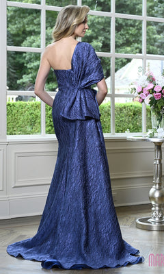 A woman seen from behind wearing a floor-length, one-shoulder navy blue jacquard Marsoni MV1437 formal dress with a textured finish and a large bow at the waist.