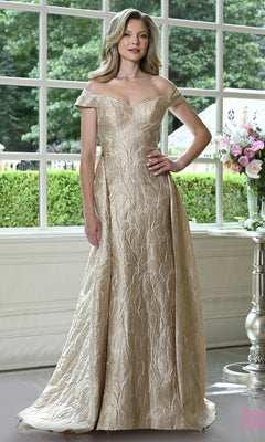 A woman wears a gold Marsoni MV1440 off-the-shoulder floral jacquard evening gown with a floor-length skirt.