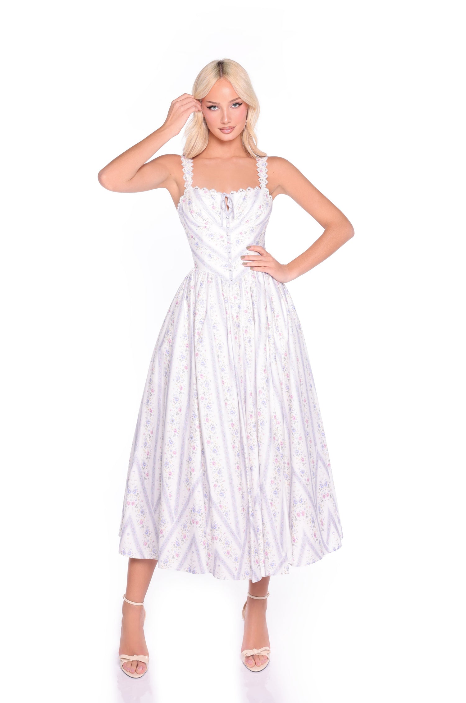 A person wears the Mirelle Lilac Striped Floral Casual Midi Dress with ruffled straps and white high-heeled sandals, posed against a plain white background.
