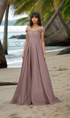 A woman in the Off-Shoulder Long A-Line Prom Dress: Chicas BT9025 stands on a sandy beach, palm trees swaying and ocean sparkling behind her, the shimmery mauve gown catching the light.