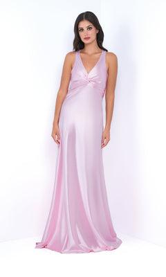 A woman models the Odette by Velvi sleeveless satin long prom dress in light pink, featuring an empire waist, V-neckline, and knotted bust detail, standing against a plain white background.