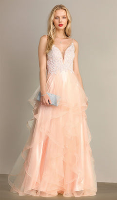 A woman models the Chicas XR6006 Sheer-Sides Long Tiered Prom Dress—light pink, sleeveless, with a lace bodice and layered tulle skirt—holding a silver clutch against a plain background.