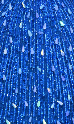 Close-up of the PromGirl Exclusive 250304S Mini Sequin Hoco Dress, featuring blue fabric with vertical rows of iridescent teardrop-shaped embellishments—perfect for a sexy homecoming look.