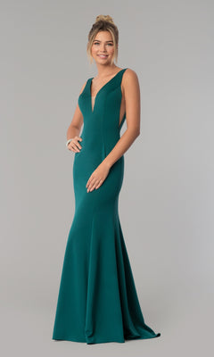 A woman models the Sleeveless V-Neck Long Formal Prom Dress 8158 in green—a floor-length gown with a deep neckline and elegant silhouette, shown against a plain grey background.
