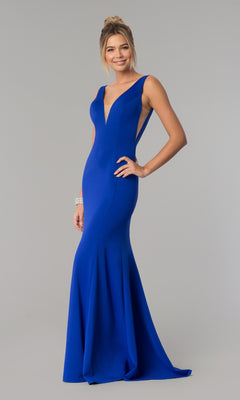 A woman models the Sleeveless V-Neck Long Formal Prom Dress 8158 in royal, featuring a fitted silhouette, against a plain light gray background.