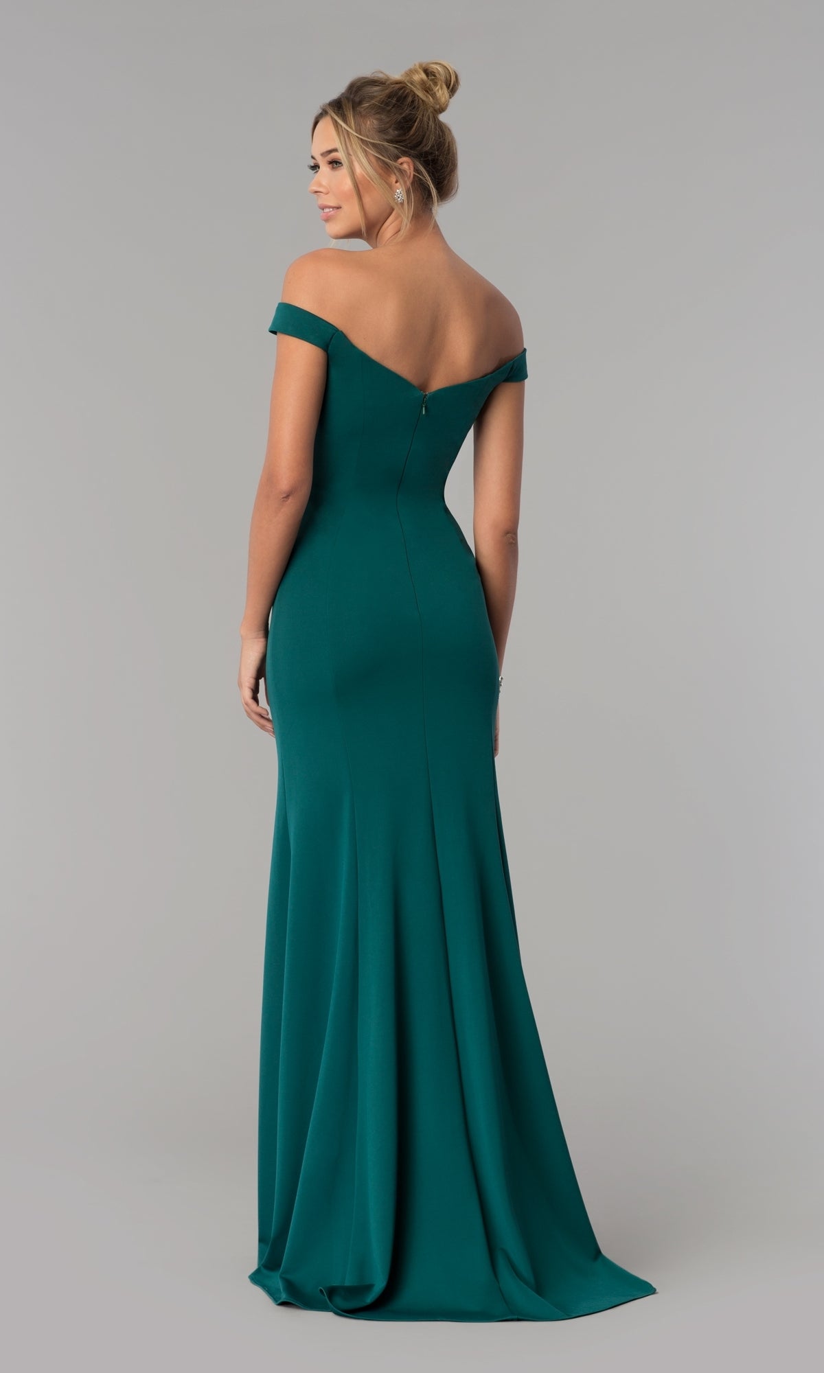 A woman models the Simple Off-the-Shoulder Long Formal Prom Dress 8160 in floor-length emerald green, standing with her back to the camera against a plain grey background.
