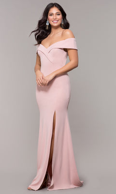 Woman models the Classic Off-the-Shoulder Formal Prom Dress 8258, featuring light pink fabric, a sweetheart neckline, and front slit, against a plain gray background.