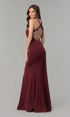 A woman models the Simple Sleeveless Long Jersey Prom Dress 8298—maroon, open-back, with a crisscross design—standing and glancing over her shoulder against a plain background.