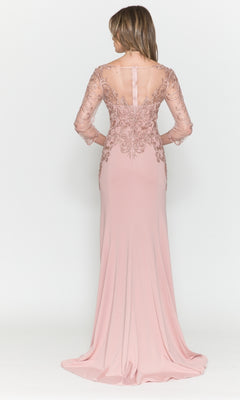 A woman models the Embroidered Sheer-Sleeved Long Prom Dress 8564, showcasing its sheer lace sleeves, embroidered details, and flowing floor-length skirt as she faces away.