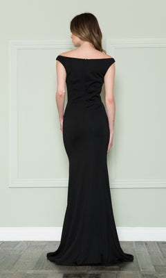 A woman stands facing away, wearing the Off-the-Shoulder Classic Long Prom Dress 8724 in black jersey, set against a pale green wall with decorative molding.