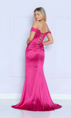 A woman stands against a light wall in the Off-the-Shoulder Long Corset Prom Dress 9024—a fitted, floor-length pink satin gown with lace-up back detailing that captures the elegance of formalwear.