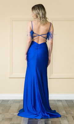 A woman stands facing away in the affordable Open-Back Long Feathered Prom Dress 9070—a royal blue, floor-length gown with thin straps, a low open back, and feathered accents on the shoulders.