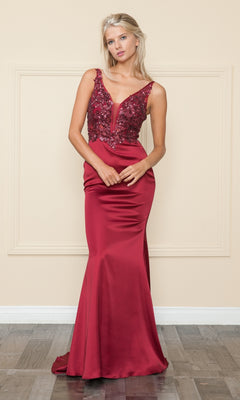 A woman wearing the Sequin-Bodice Long Satin Prom Dress 9162, a sleeveless red gown with a sequined bodice and satin skirt, stands against a beige wall and wooden floor.