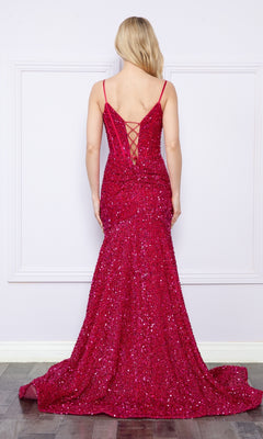 Someone stands facing away from the camera wearing the Long Sequin Prom Dress with Lace-Up Back 9172, a floor-length, bright pink sequin gown featuring thin straps and a corset-style lace-up back.
