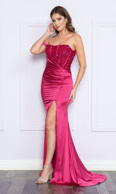 A woman wearing the One-Shoulder Sequin-Bodice Long Prom Dress 9178, a floor-length gown with sparkling sequins and a thigh-high slit, stands against a white paneled wall.