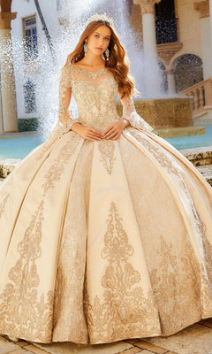 A woman in the Princesa PR12004 Quinceañera Dress with bell sleeves and a tiara poses with clasped hands in front of a fountain.