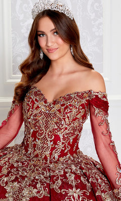 A young woman poses indoors in the Princesa Off-the-Shoulder Lace Quince Dress PR12267, a red and gold gown with intricate beading, lace-up corset back, silver tiara, chandelier earrings, against a decorative white background.