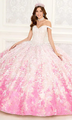 A young woman wears the PR12275 Princesa Quinceañera Dress featuring an off-the-shoulder fitted white bodice, embroidered lace details, and a full pink and white floral skirt, paired with a jeweled crown and necklace.