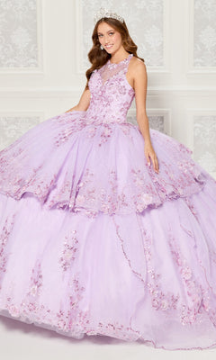 A young woman in the Quinceanera Dress PR30082 By Princesa, featuring light purple fabric and delicate floral embroidery, poses with a tiara in front of a white patterned wall.