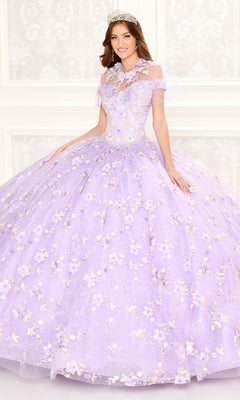 A woman poses in a formal setting wearing the Quinceanera Dress PR30084 By Princesa, featuring a lavender hue, corset back, and flower embellishments against a light decorative background.